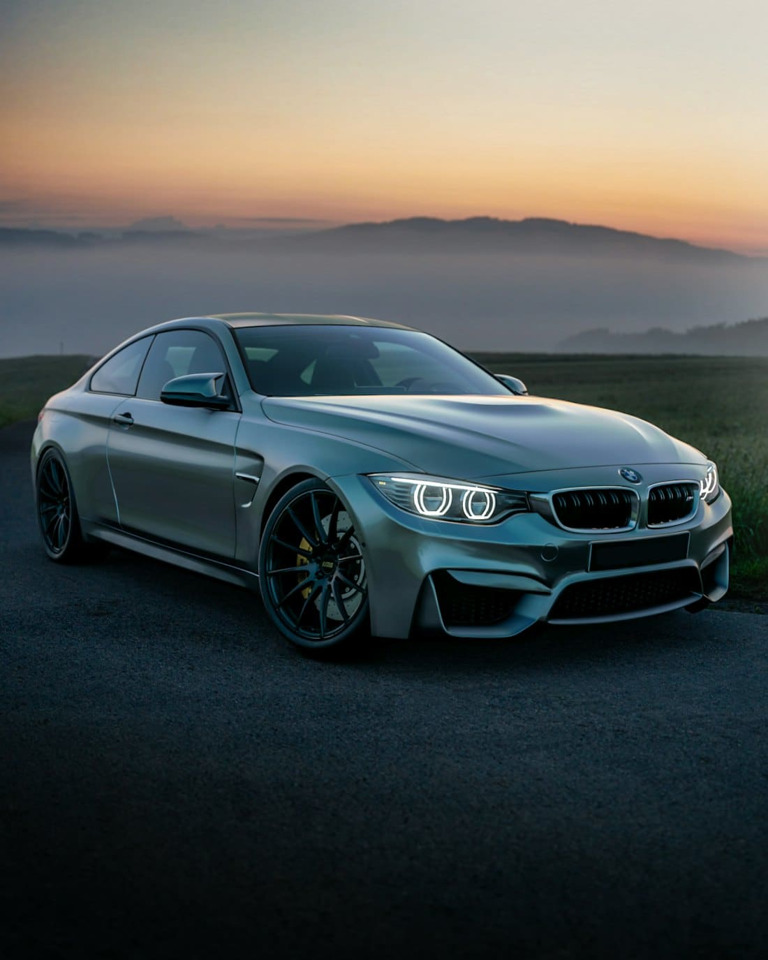 Grey coupe with a fresh gloss finish at sunset