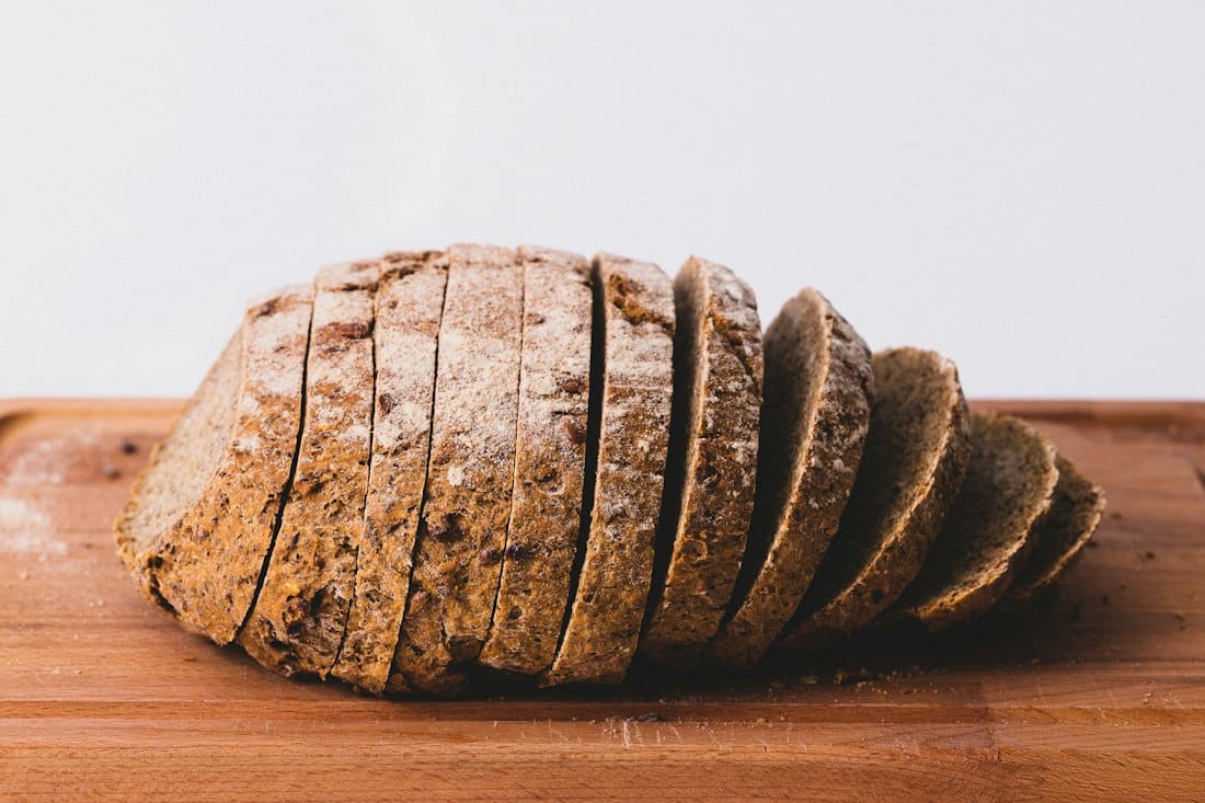 A rye loaf sliced on a wooden board