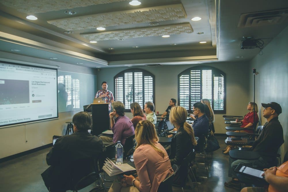Seminar room full of learners during a presentation
