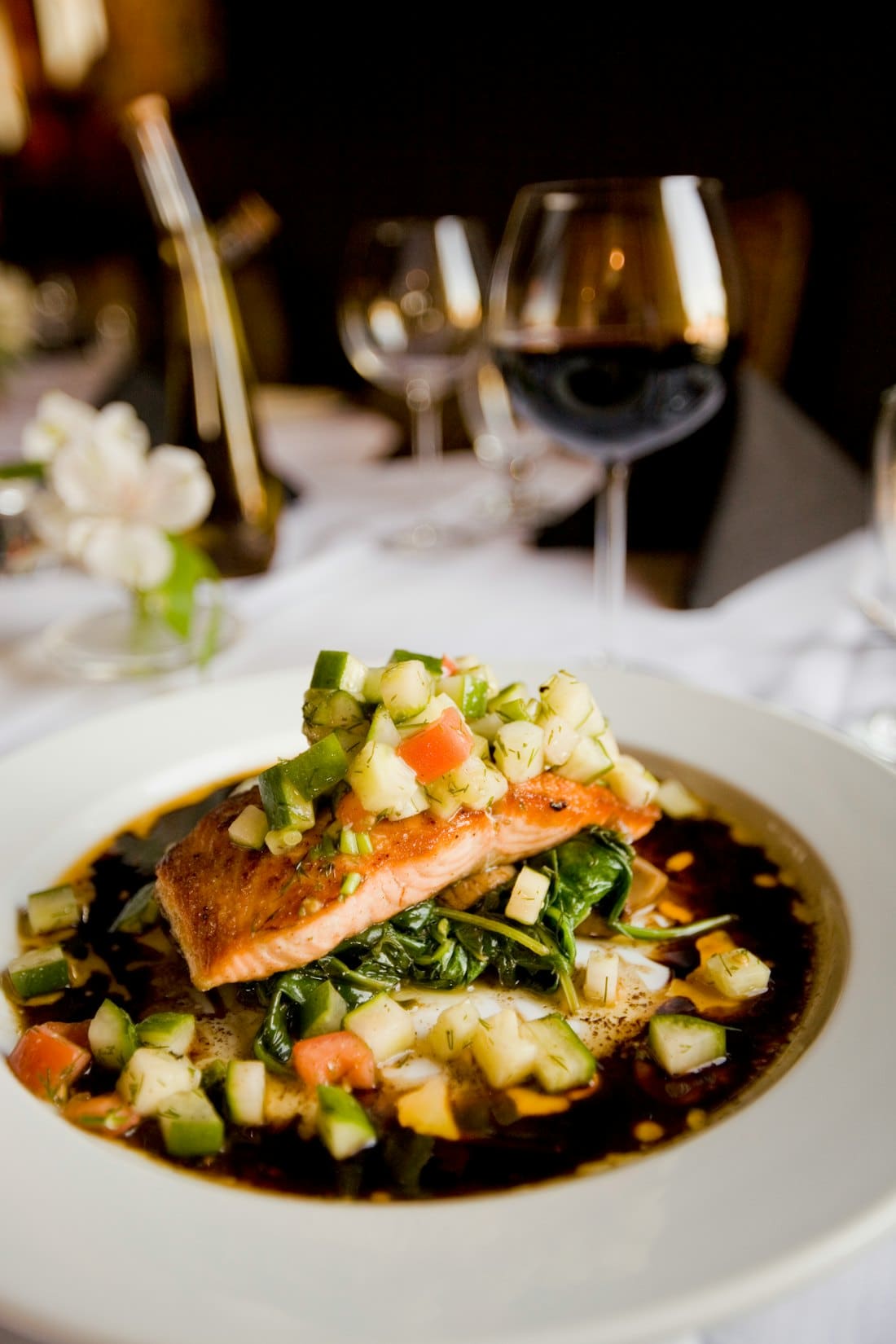 Roast salmon with vegetables in a dark sauce
