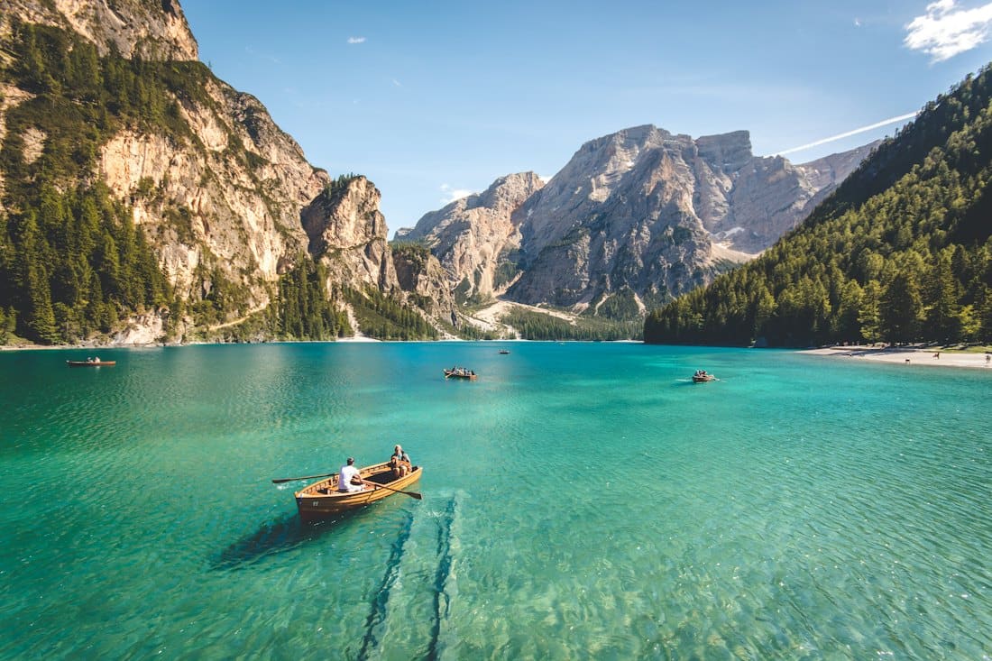 Emerald alpine lake ringed by Dolomite peaks